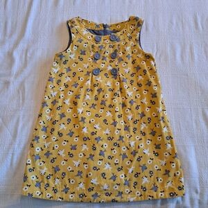 Mini Boden girls size 4-5 years pinnie, mustard with bird & flower dedign